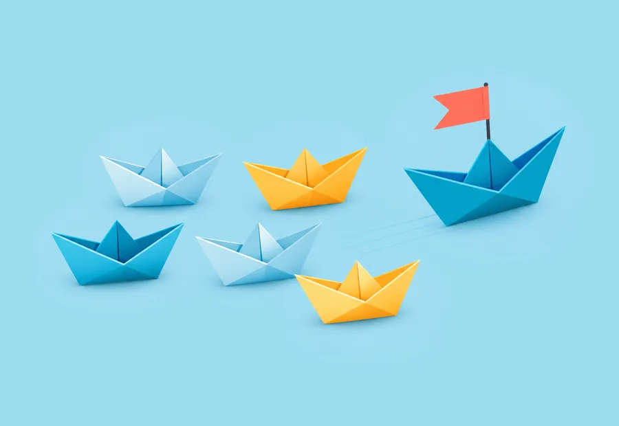 Six paper boats with a flag on the largest blue boat.