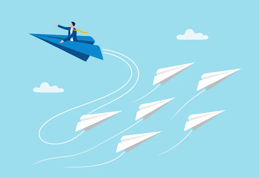 Person steering a blue paper airplane along a different path from a group of white airplanes.