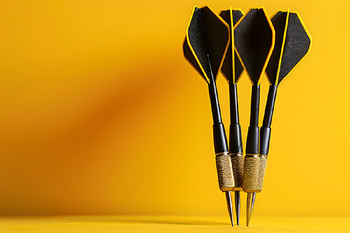 Darts hitting a target, symbolizing the precision and focus required for successful sales with the MEDDIC framework.